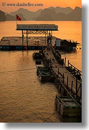 asia, colors, dock, ha long bay, mountains, nature, sky, sun, sunsets, vertical, vietnam, yellow, photograph