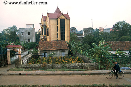 man-on-bike-by-building.jpg