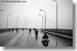asia, bikes, black and white, hanoi, horizontal, motorcycles, rain, vietnam, photograph