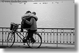 asia, bicycles, bikes, black and white, couples, hanoi, horizontal, hugging, people, vietnam, photograph