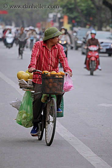man-riding-bike-w-fruit-2.jpg