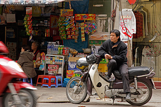 man-sitting-on-motorcycle.jpg