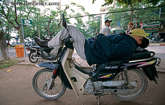 man-sleeping-on-motorcycle.jpg