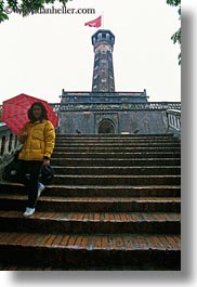 asia, flags, girls, hanoi, military history museum, red, stairs, umbrellas, vertical, vietnam, photograph