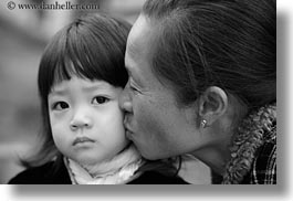 asia, black and white, childrens, girls, grandmother, hanoi, horizontal, kissing, people, vietnam, photograph