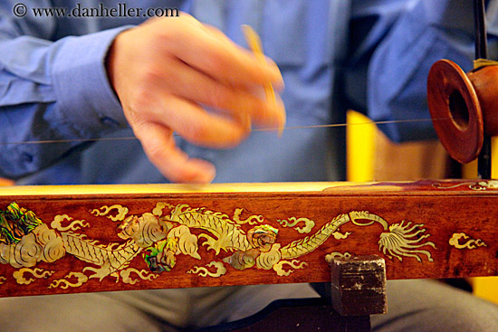 large string instrument played with fingers large string instrument played with fingers
