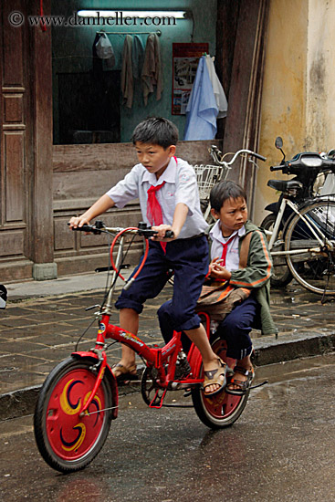 boy-n-toddler-on-red-bike-1.jpg