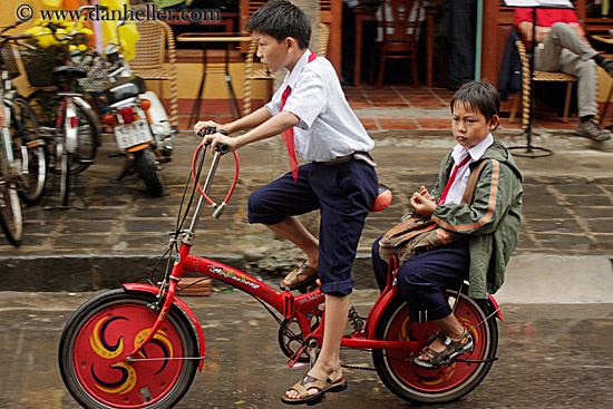 boy-n-toddler-on-red-bike-2.jpg