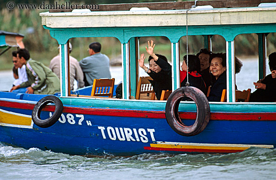 women-waving-from-tourist-boat.jpg