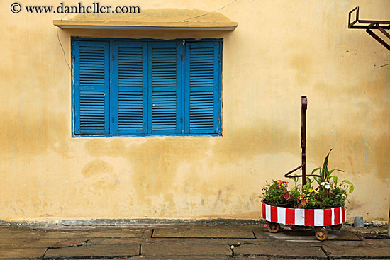 blue-window-shutters-n-yellow-wall.jpg