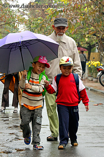 boys-walking-w-old-man-w-umbrella-1.jpg