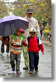 images/Asia/Vietnam/HoiAn/People/Kids/boys-walking-w-old-man-w-umbrella-1.jpg