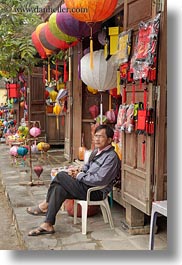 asia, colored, hoi an, lanterns, men, people, under, vertical, vietnam, photograph