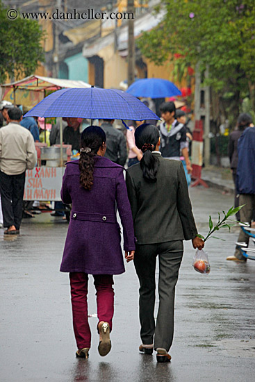 two-women-under-blue-umbrella.jpg