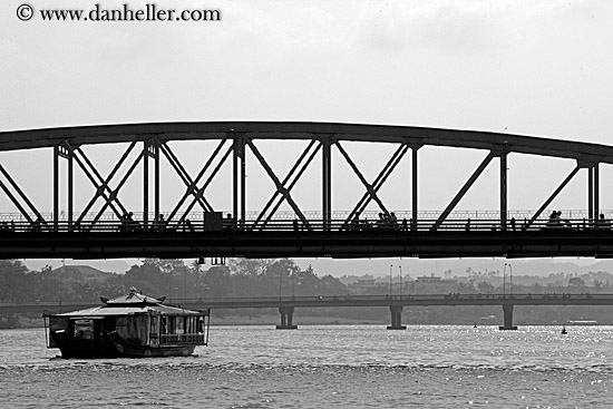 ferry-going-under-bridge-bw-2.jpg