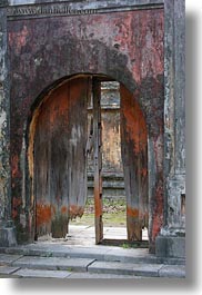arches, asia, broken, citadel, doors, hue, old, vertical, vietnam, woods, photograph