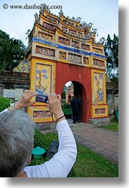 asia, citadel, doors, hue, pagoda, photographing, red, vertical, vietnam, womens, photograph