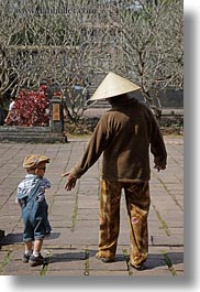 asia, boys, clothes, conical, hats, hue, khai dinh, men, tu duc tomb, vertical, vietnam, walking, photograph