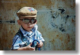 images/Asia/Vietnam/Hue/People/Children/toddler-boy-w-sunglasses-n-umbrella-5.jpg