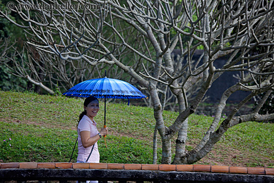 smiling-woman-w-blue-umbrella.jpg