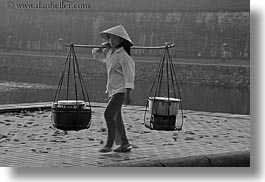 asia, asian, black and white, carrying, clothes, conical, don, ganh, hats, horizontal, hue, people, vietnam, womens, photograph