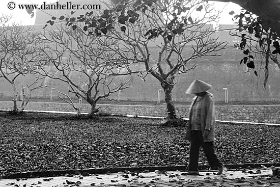 woman-walking-thru-leaves-bw.jpg