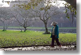 asia, asian, clothes, conical, hats, horizontal, hue, leaves, people, vietnam, walking, womens, photograph