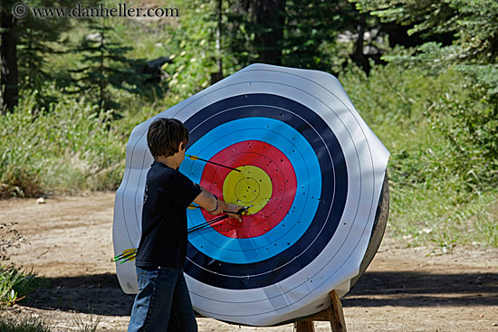 boy-pulling-arrows-from-target-2.jpg