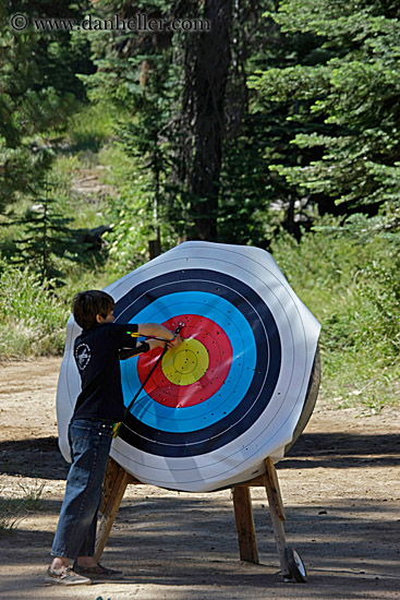 boy-pulling-arrows-from-target-3.jpg