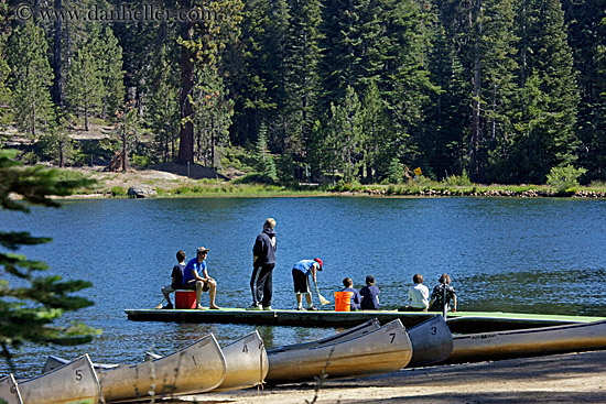 kids-on-dock-n-canoes-on-beach.jpg