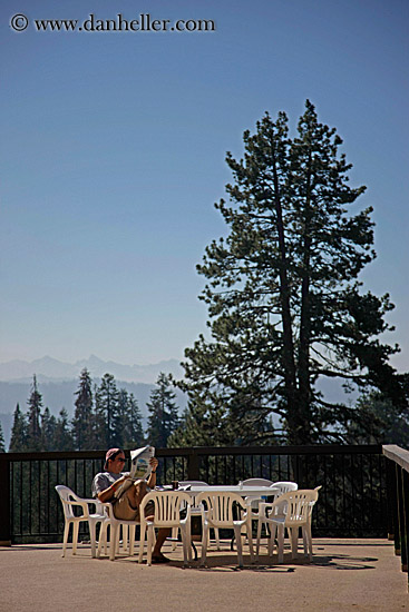 man-reading-newspaper-at-table-2.jpg