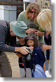 artists, blonds, california, cameras, emotions, men, mendocino, people, photographers, showing, smiles, vertical, west coast, western usa, photograph