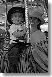 amusement park ride, black and white, boys, california, childrens, happy, hats, jacks, merry go round, oakland zoo, toddlers, vertical, west coast, western usa, photograph