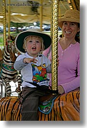 amusement park ride, boys, california, childrens, happy, hats, jacks, merry go round, oakland zoo, toddlers, vertical, west coast, western usa, photograph