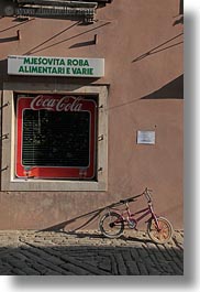 bicycles, cobblestones, coca cola, croatia, europe, groznjan, materials, signs, stones, vertical, photograph