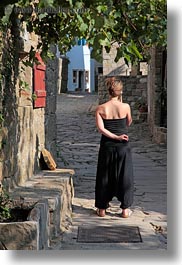 cobblestones, croatia, europe, groznjan, materials, narrow streets, phones, stones, streets, vertical, womens, photograph