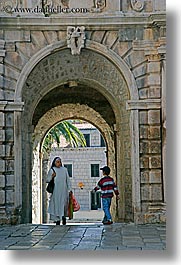 arches, archways, boys, childrens, croatia, europe, korcula, nuns, religious, sequence, vertical, womens, photograph