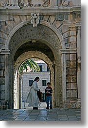 arches, archways, boys, childrens, croatia, europe, korcula, nuns, religious, sequence, vertical, womens, photograph