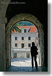 arches, archways, croatia, europe, korcula, silhouettes, under, vertical, womens, photograph