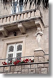 balconies, croatia, europe, flowers, korcula, statues, vertical, photograph