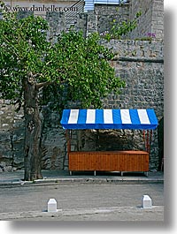 awnings, blues, croatia, europe, korcula, striped, trees, vertical, photograph