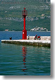 croatia, europe, korcula, lamp posts, motorcycles, red, vertical, photograph