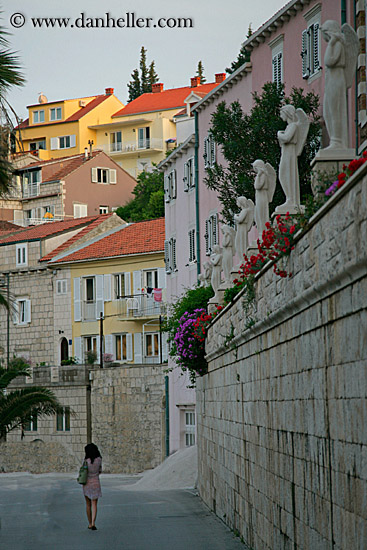 woman-walking-by-statues.jpg