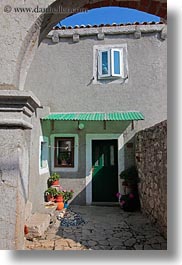 archways, croatia, doors, europe, flowers, lubenice, structures, vertical, photograph