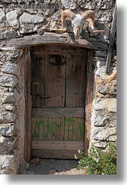 croatia, doors, europe, lubenice, skulls, vertical, photograph