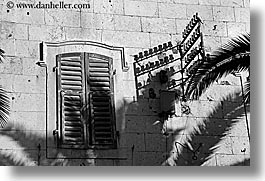 black and white, croatia, europe, horizontal, milna, palm trees, shadows, walls, windows, photograph