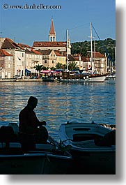 croatia, europe, men, milna, people, silhouettes, towns, vertical, water, photograph