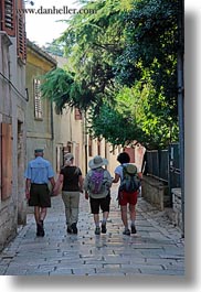 cobblestones, croatia, europe, four, hikers, marble, materials, porec, sidewalks, stones, vertical, photograph