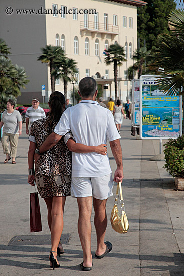 man-walking-w-woman-in-leopard-skin.jpg