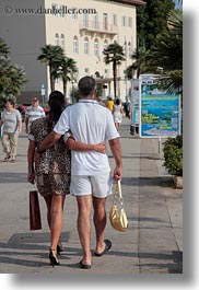 couples, croatia, europe, leopard, men, people, porec, skin, vertical, walking, womens, photograph